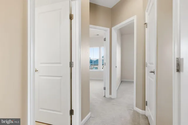 a bathroom with a granite countertop sink a mirror and a bathtub