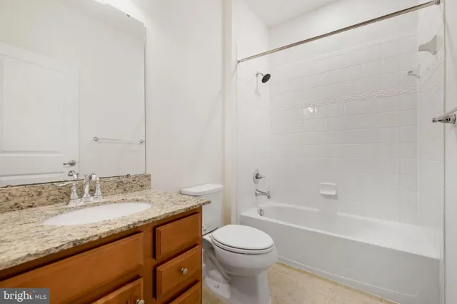 a view of a bathroom with a shower and a sink