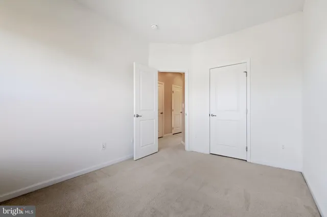a view of wooden floor and cabinets in a room