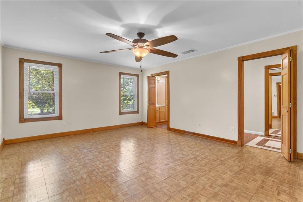 1900 South Duncanville Road Red Oak, TX 75154 - Photo 17 of 39 Primary bedroom with ceiling fan and ensuite bathroom.