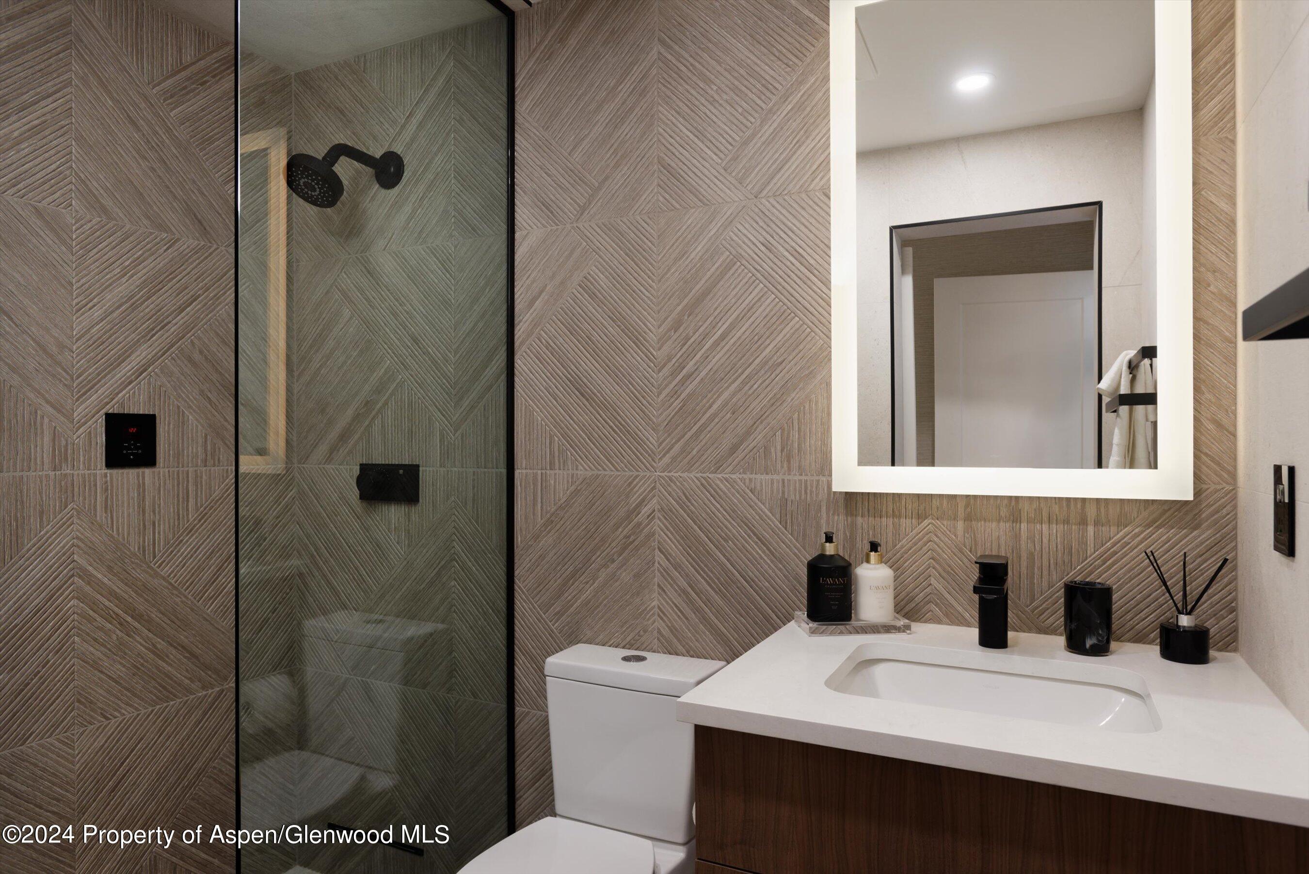 205 East Durant Avenue, Unit 1I Aspen, CO 81611 - Photo 21 of 45 a bathroom with a sink toilet and shower