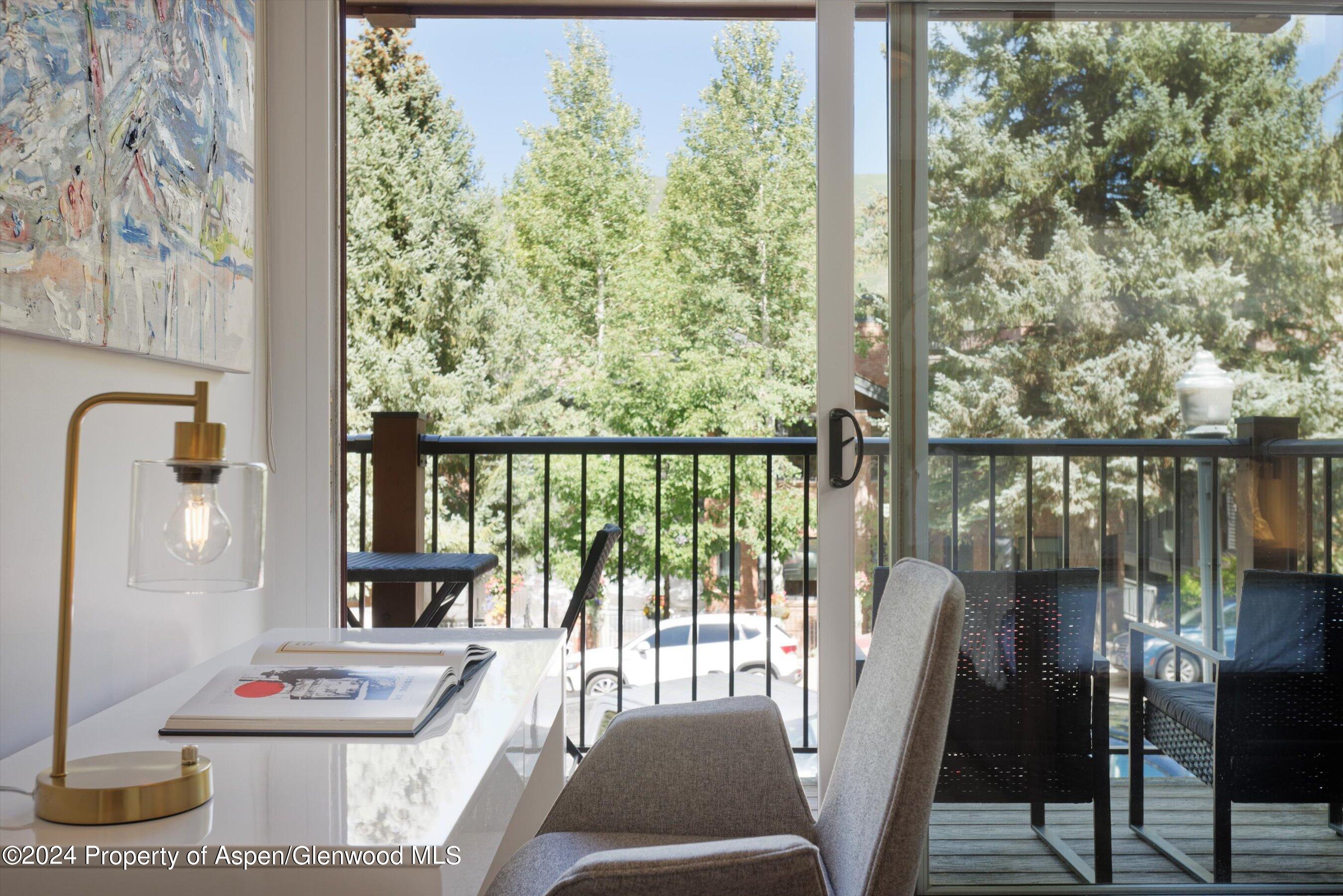 205 East Durant Avenue, Unit 1I Aspen, CO 81611 - Photo 24 of 45 a view of a balcony with chairs