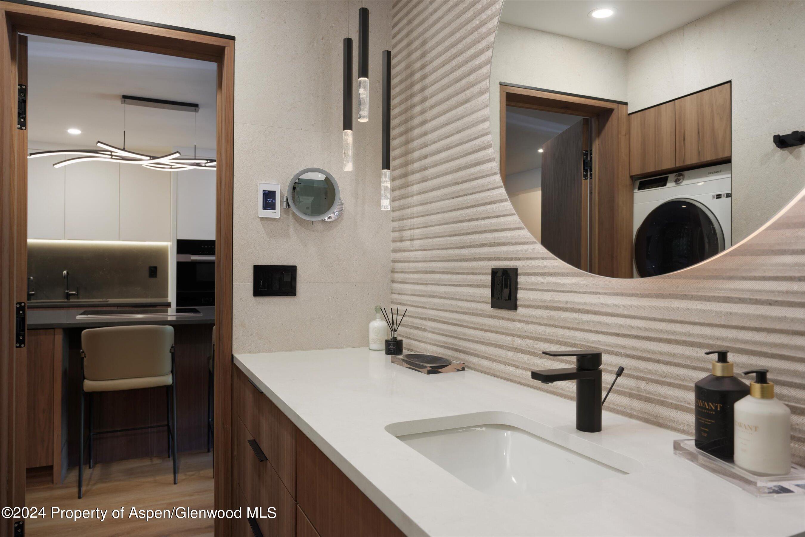 205 East Durant Avenue, Unit 1I Aspen, CO 81611 - Photo 25 of 45 a bathroom with a sink and a mirror