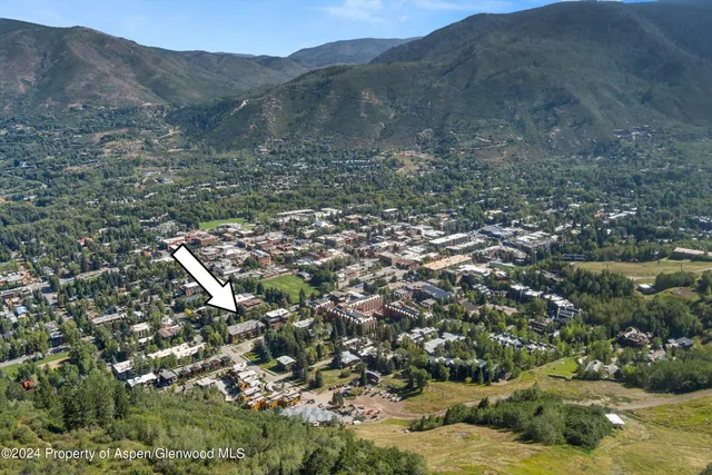a view of a cars parked in front of a building