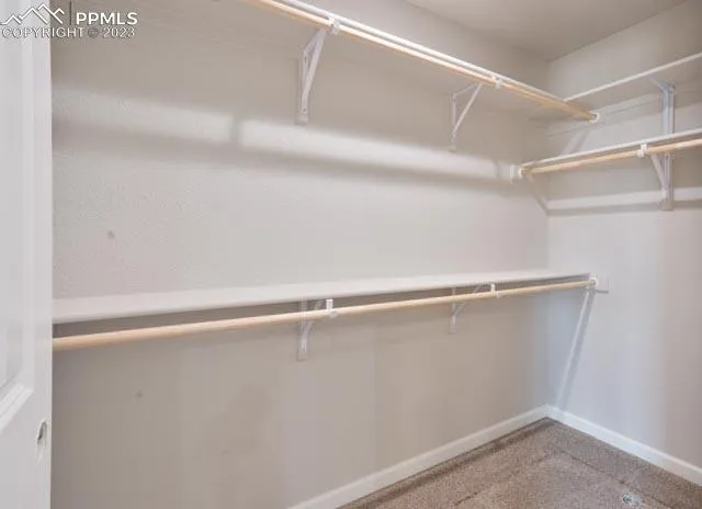 a bathroom with a shower a toilet and a sink