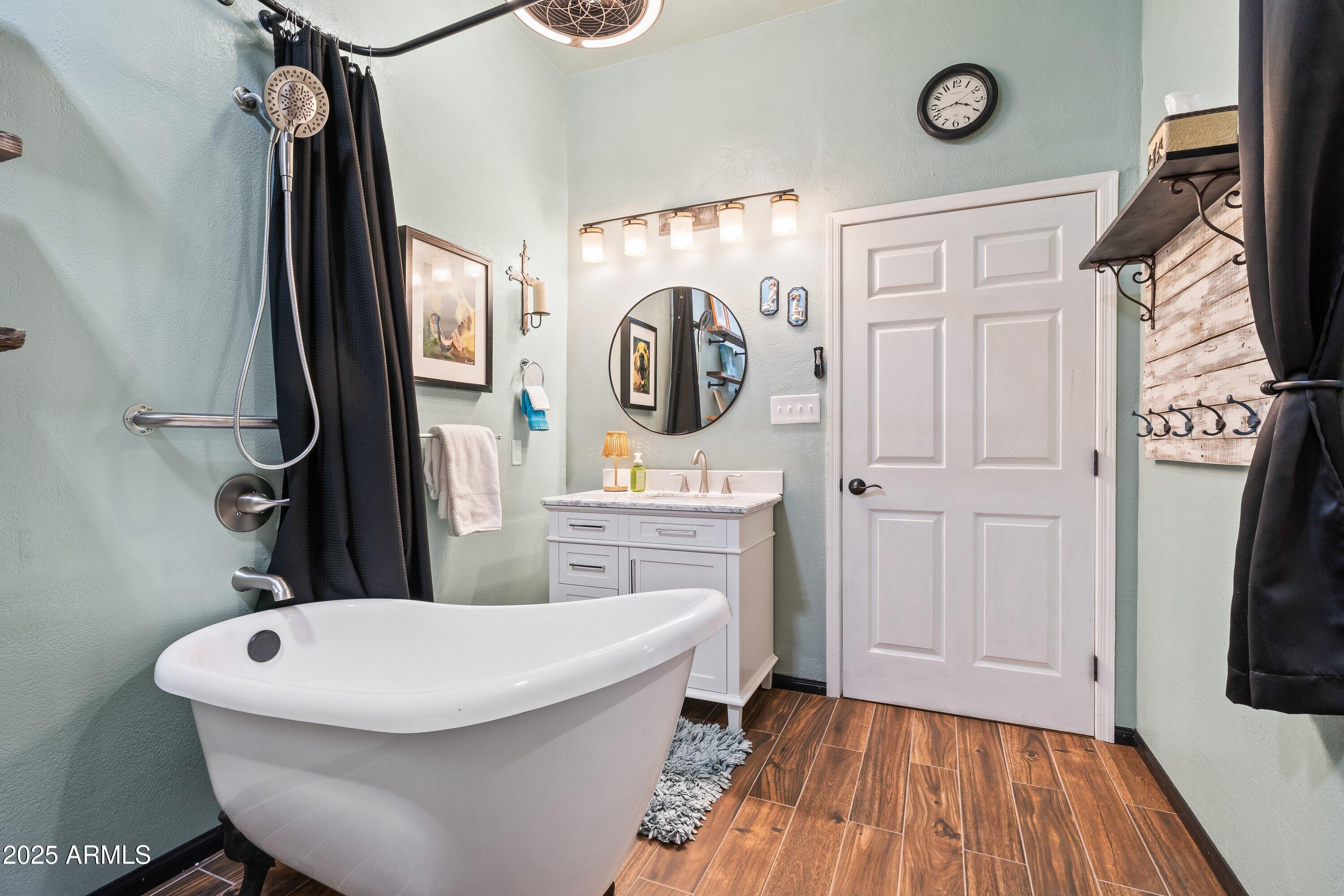 105 Los Encinos Road Sonoita, AZ 85637 - Photo 22 of 39 a bathroom with a toilet sink and mirror