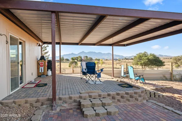 a very nice looking yard with a large tree