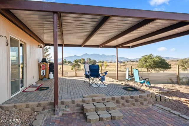 a very nice looking yard with a large tree