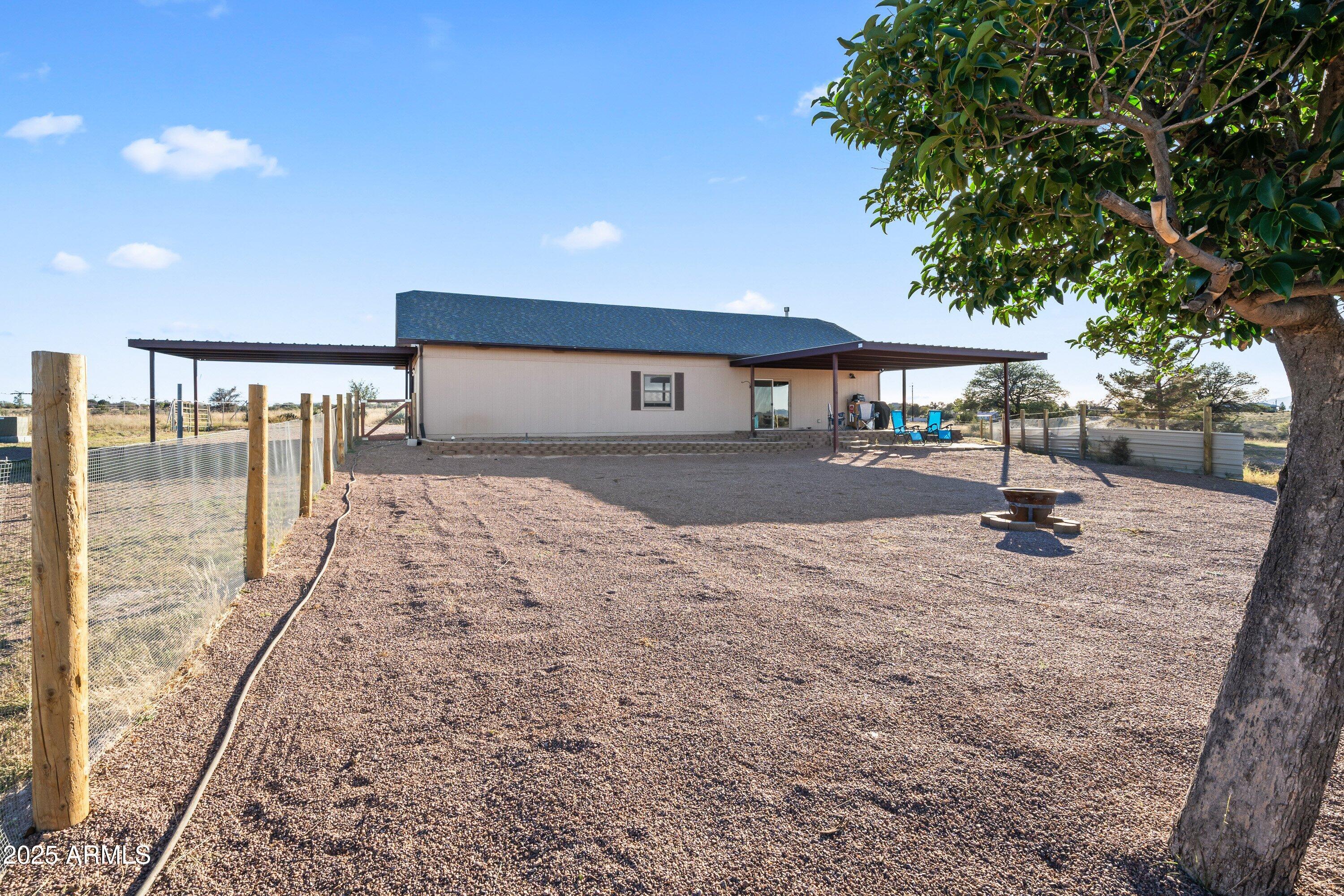 105 Los Encinos Road Sonoita, AZ 85637 - Photo 27 of 39 a very nice looking yard with a large tree