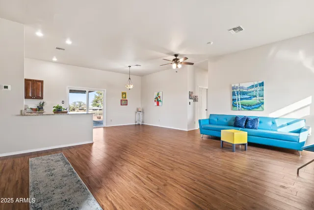a view of an kitchen and a kitchen with furniture wooden floor