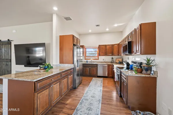 a kitchen with a sink stove and cabinets