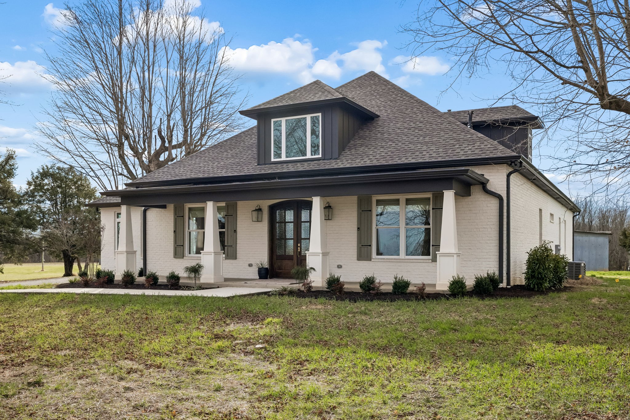 7307 Dunn Road Cedar Hill, TN 37032 - Photo 4 of 93 a front view of a house with a yard