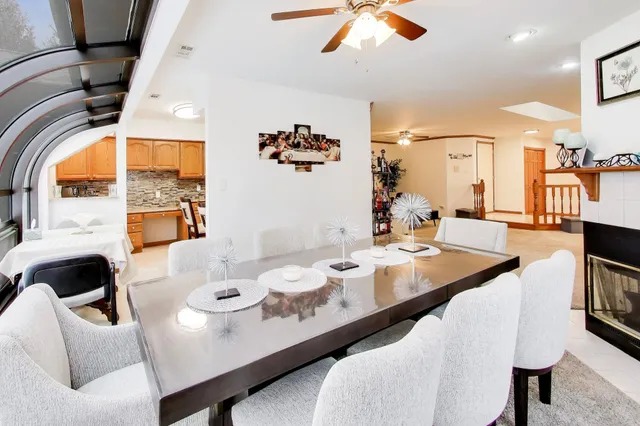 a dining room with furniture and window