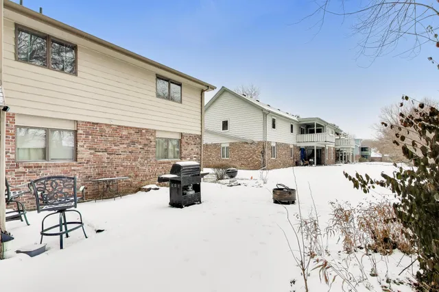 a view of outdoor kitchen with seating space