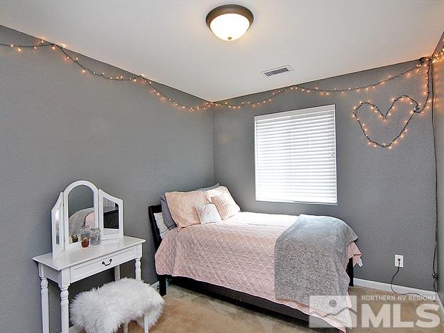 11615 Verazae Drive Reno, NV 89521 - Photo 15 of 25 a bedroom with a bed and a window