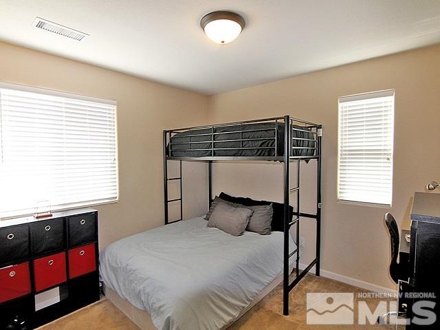 11615 Verazae Drive Reno, NV 89521 - Photo 16 of 25 a bedroom with a bed and window