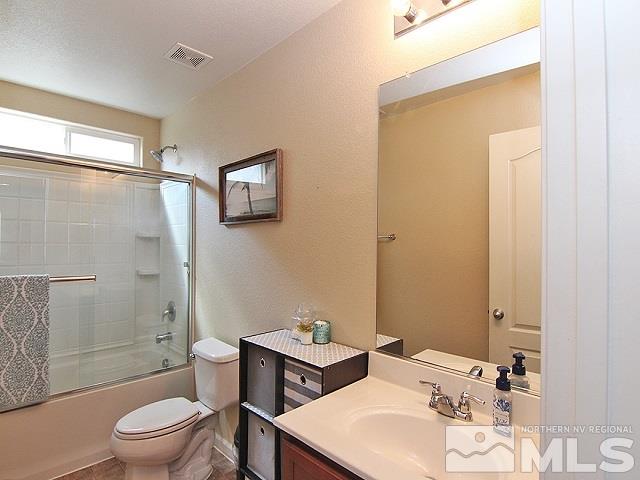 11615 Verazae Drive Reno, NV 89521 - Photo 19 of 25 a bathroom with a sink toilet and shower