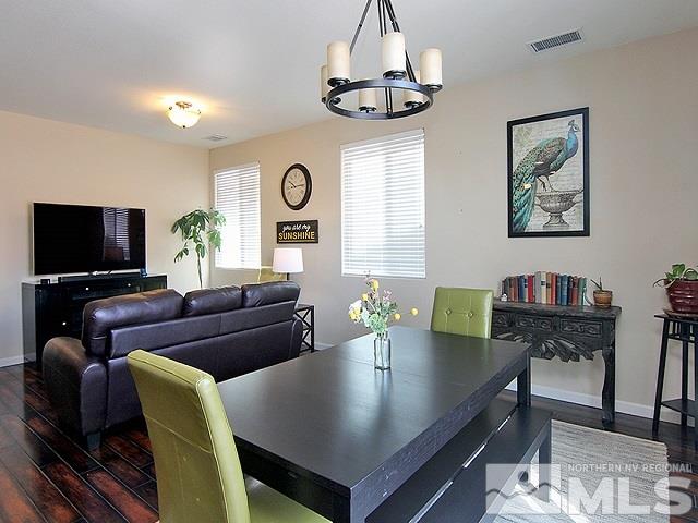 11615 Verazae Drive Reno, NV 89521 - Photo 2 of 25 a living room with furniture and a flat screen tv