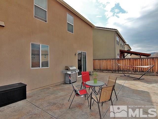 11615 Verazae Drive Reno, NV 89521 - Photo 23 of 25 a backyard of a house with table and chairs