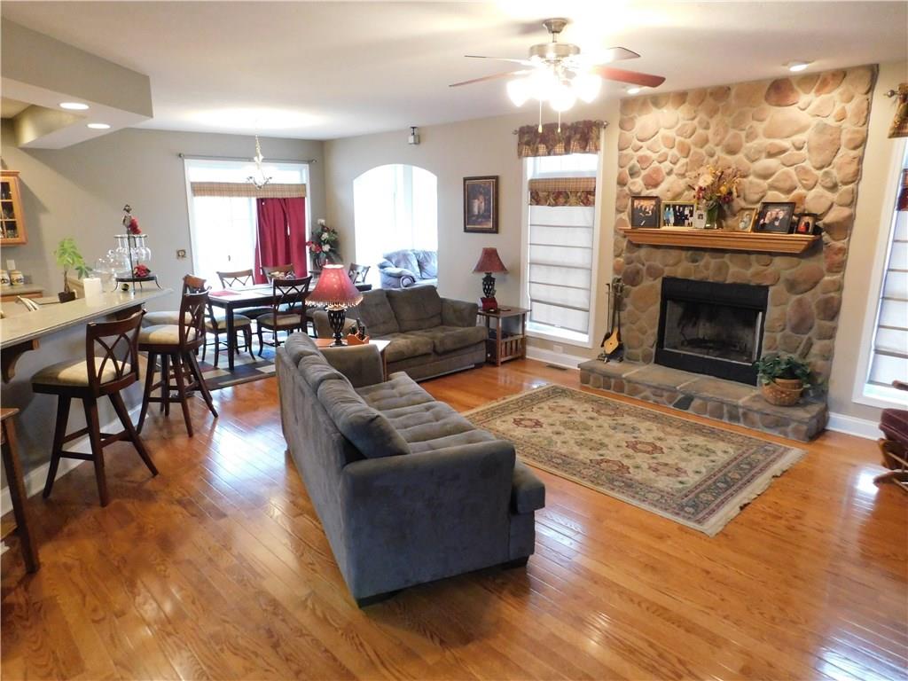56 Flick Road Hadley, PA 16130 - Photo 14 of 25 F.R./GREAT ROOM OPEN TO KITCHEN. HARDWOOD FLOORS AND STONE FIREPLACE