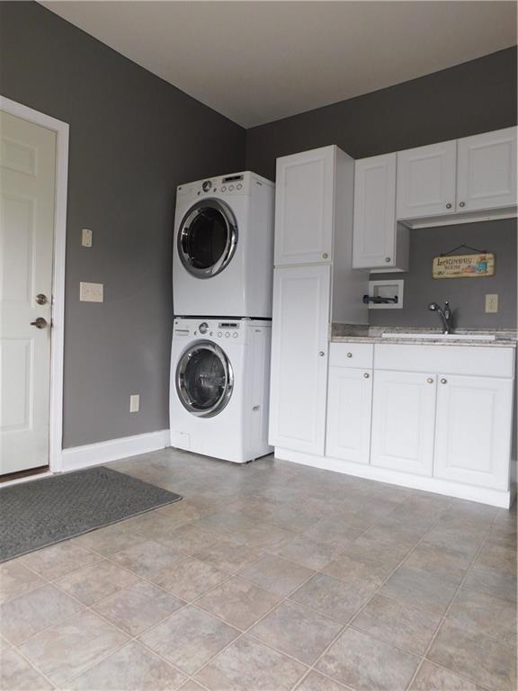 56 Flick Road Hadley, PA 16130 - Photo 22 of 25 LARGE FIRST FLOOR LAUNDRY /DUAL PURPOSE AS A MUD ROOM AND EXTRA APPLIANCE STORAGE.