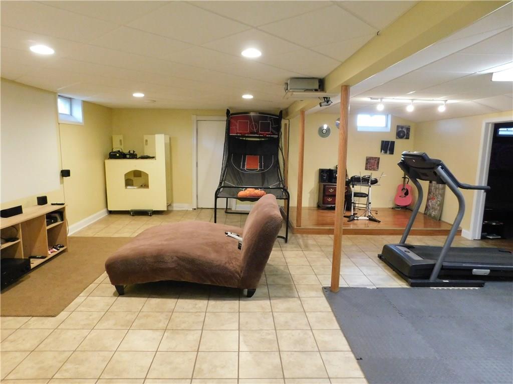 56 Flick Road Hadley, PA 16130 - Photo 24 of 25 LOWER LEVEL DEN/WITH SMALL STAGE FOR KIDS/GREAT FOR EXERCISE OR T.V. VIEWING