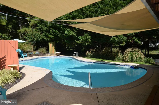 a view of a swimming pool with a patio