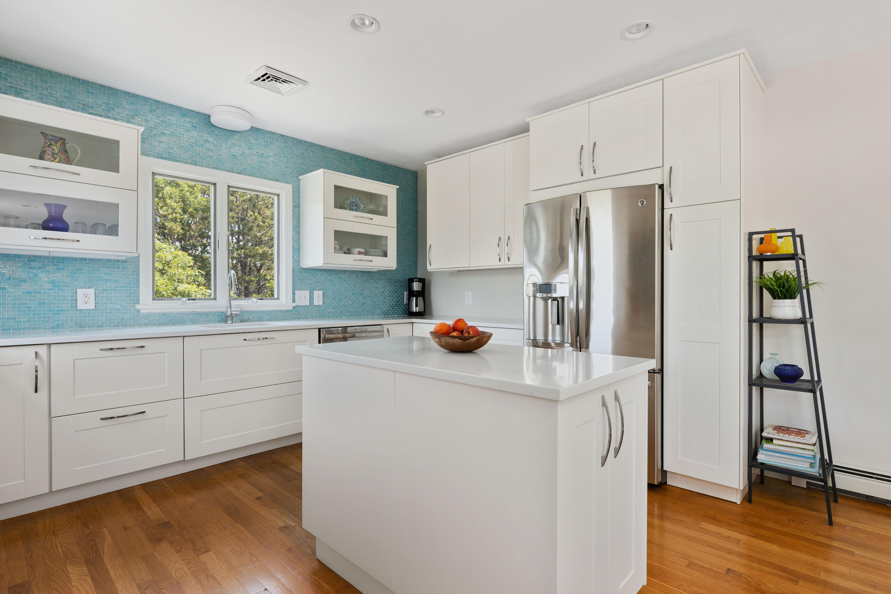 5 Starbuck Road Truro, MA 02666 - Photo 16 of 46 a kitchen with stainless steel appliances a refrigerator sink and wooden floor