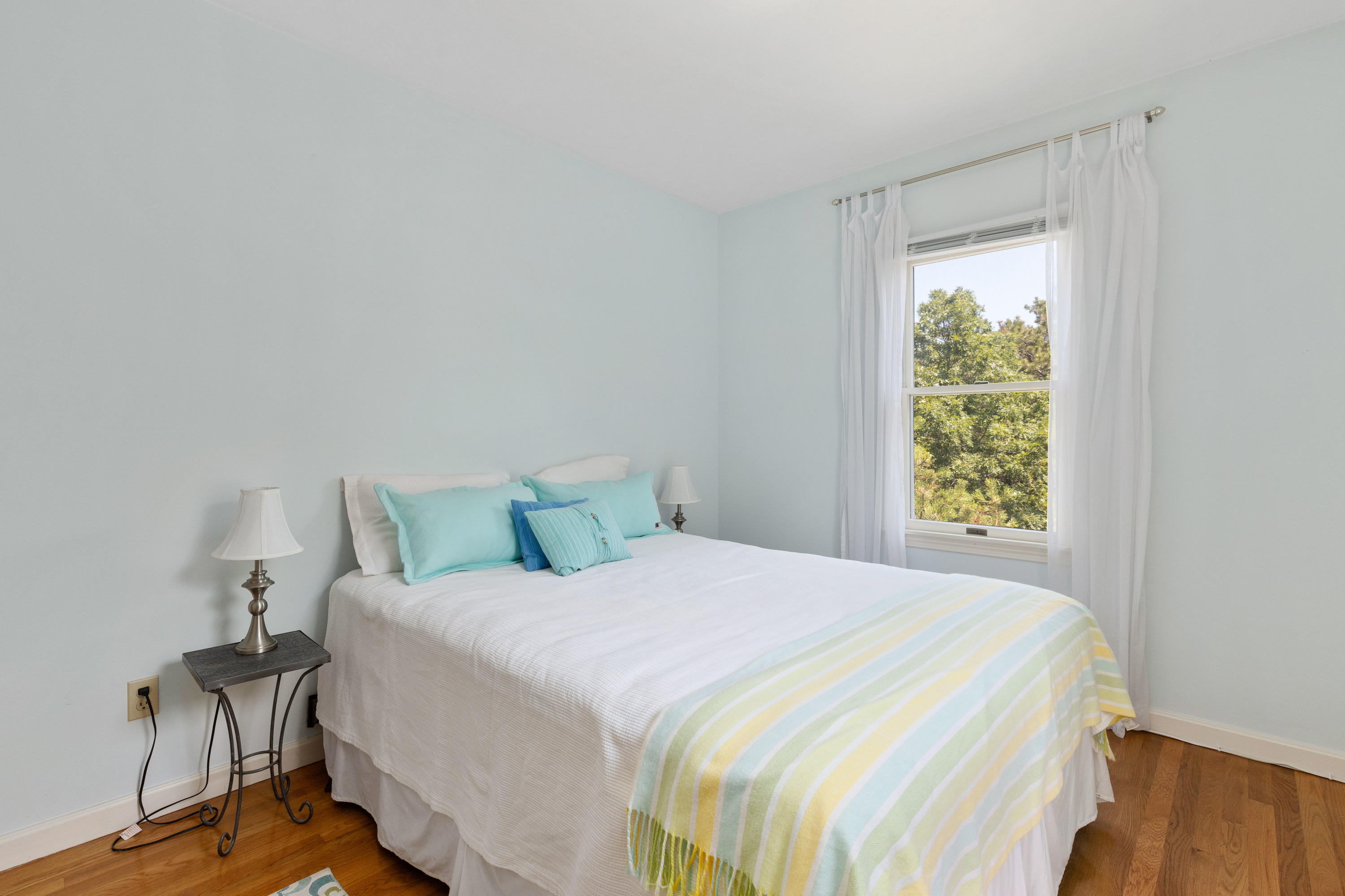 5 Starbuck Road Truro, MA 02666 - Photo 23 of 46 a bedroom with a bed and a window
