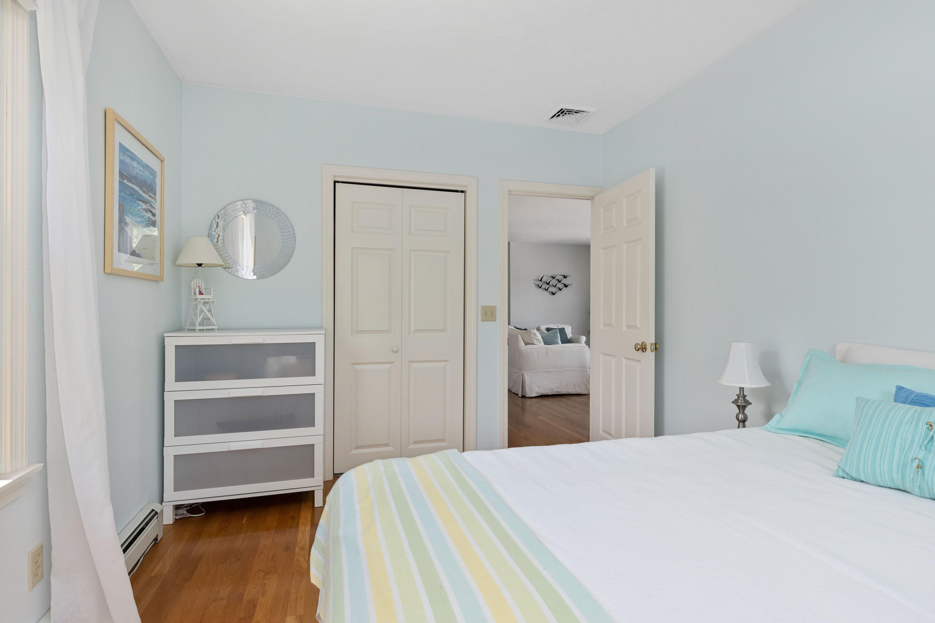 5 Starbuck Road Truro, MA 02666 - Photo 24 of 46 a bedroom with a bed and cabinets