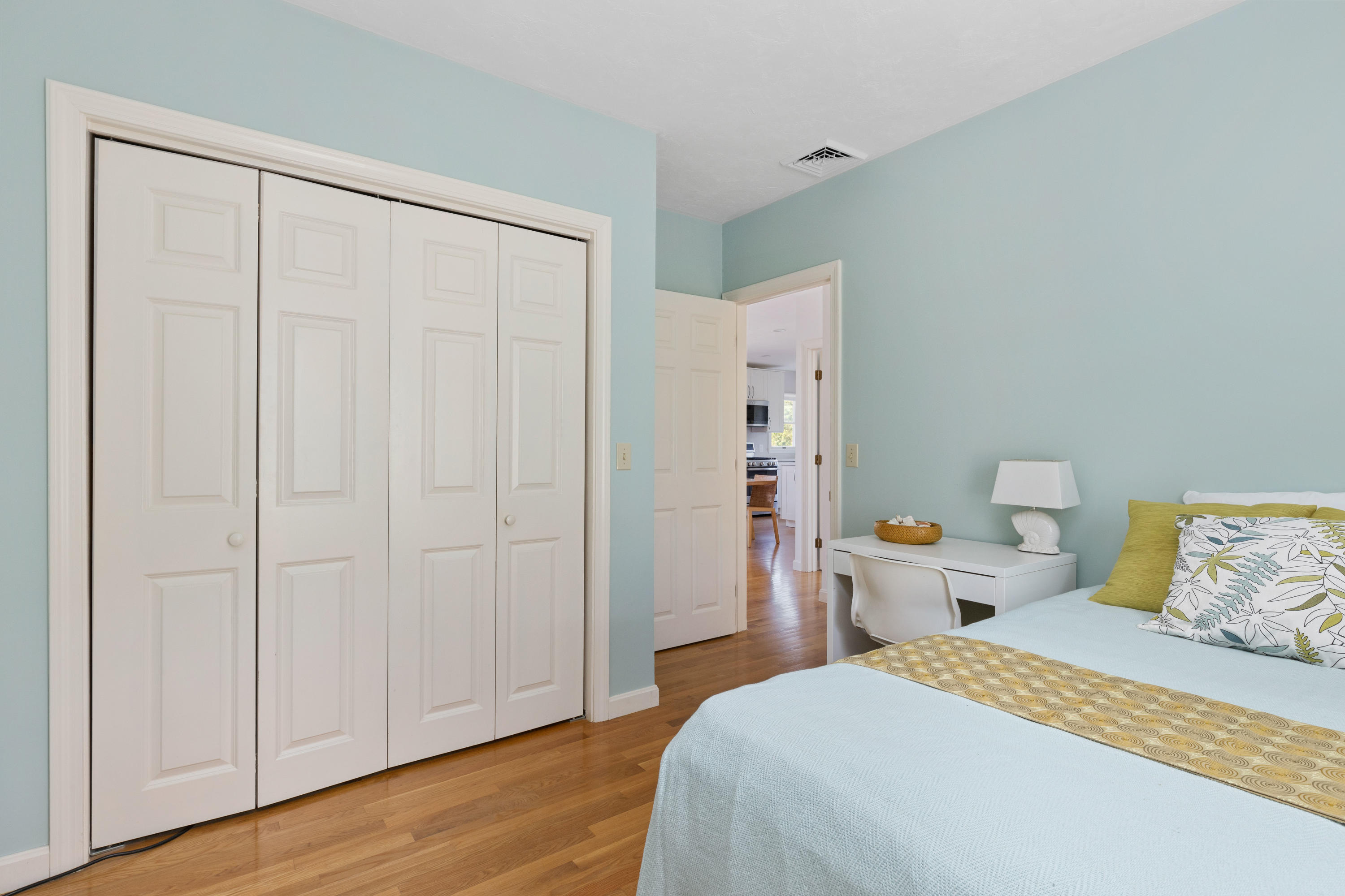 5 Starbuck Road Truro, MA 02666 - Photo 27 of 46 a bedroom with a bed and wooden floor