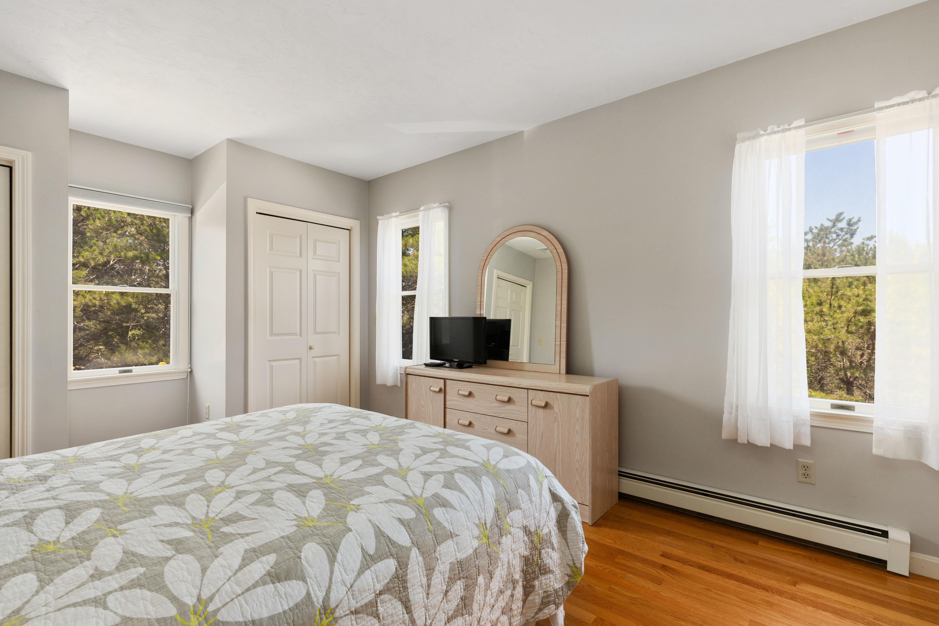 5 Starbuck Road Truro, MA 02666 - Photo 29 of 46 a bedroom with a bed and a flat screen tv