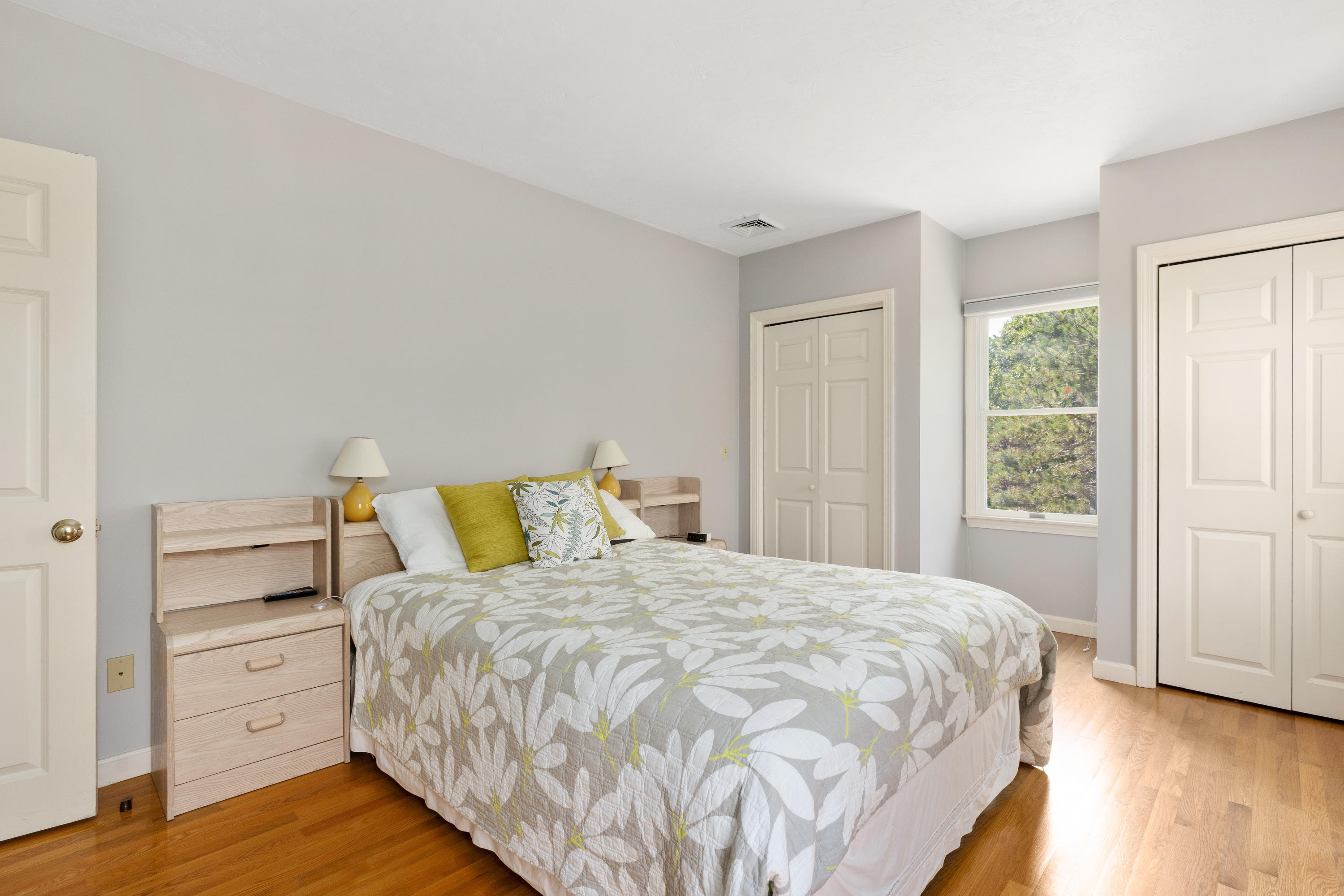 5 Starbuck Road Truro, MA 02666 - Photo 30 of 46 a large bed sitting in a bedroom next to a window and dresser