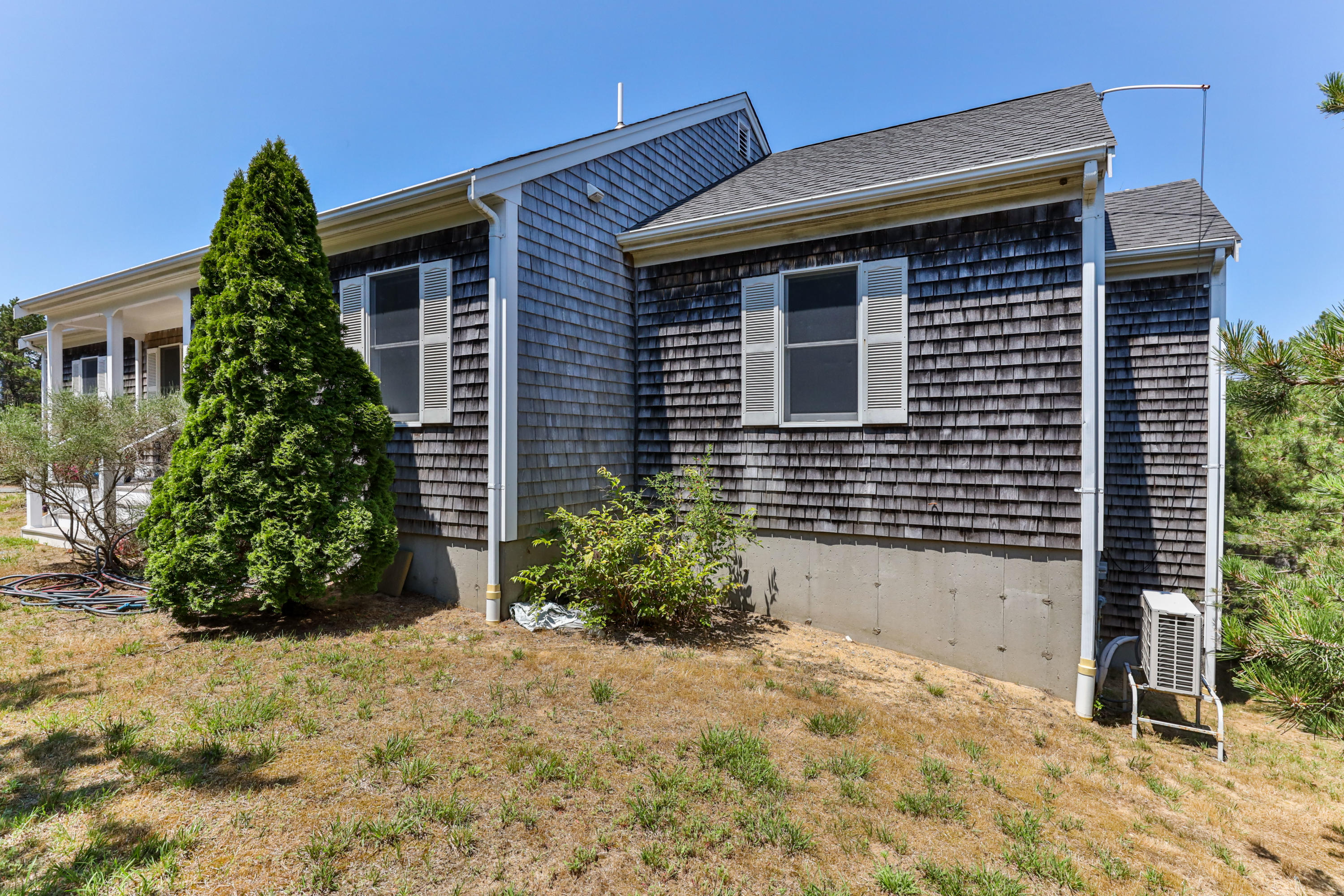 5 Starbuck Road Truro, MA 02666 - Photo 3 of 46 a front view of a house with garden