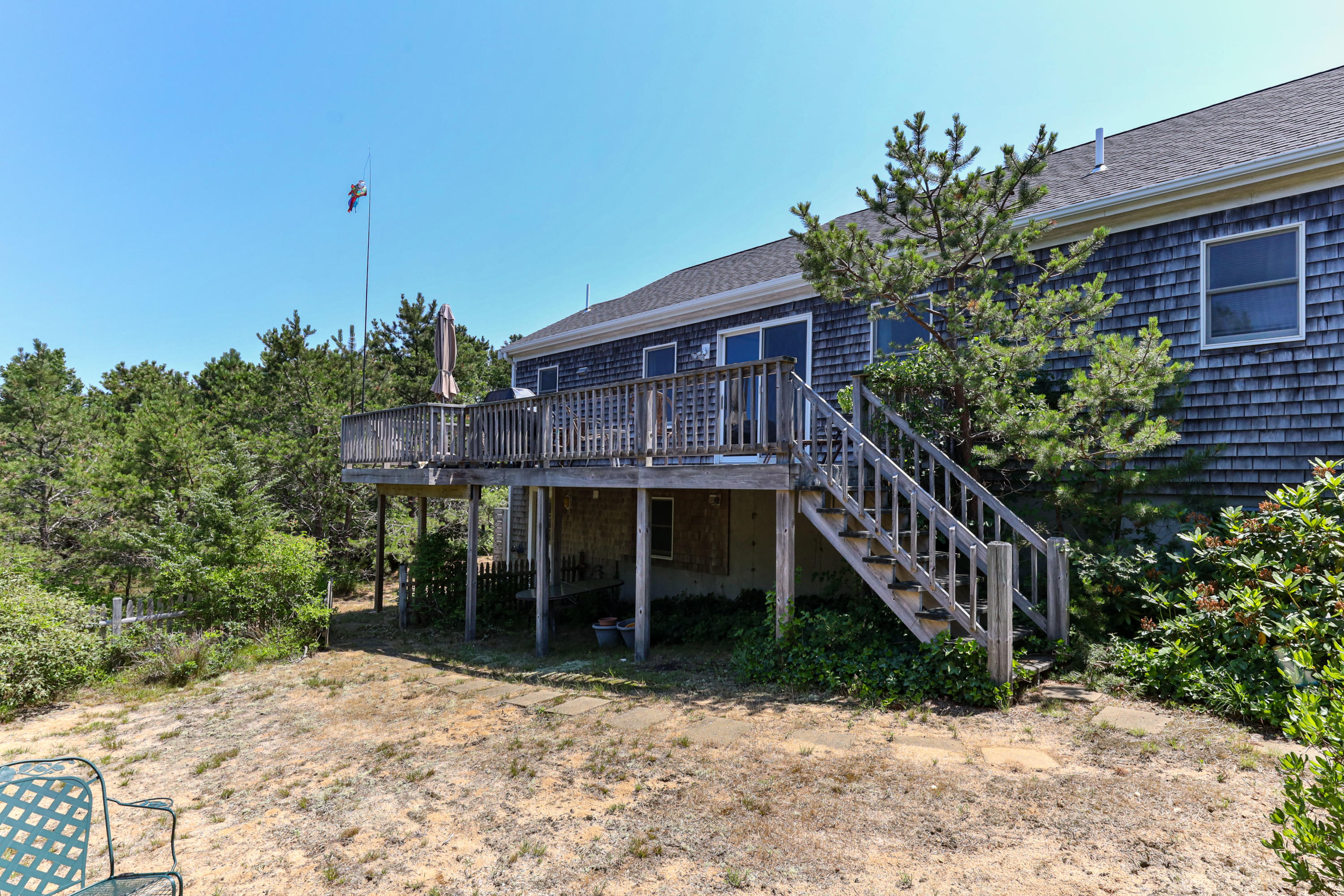 5 Starbuck Road Truro, MA 02666 - Photo 44 of 46 a backyard of a house with lots of green space