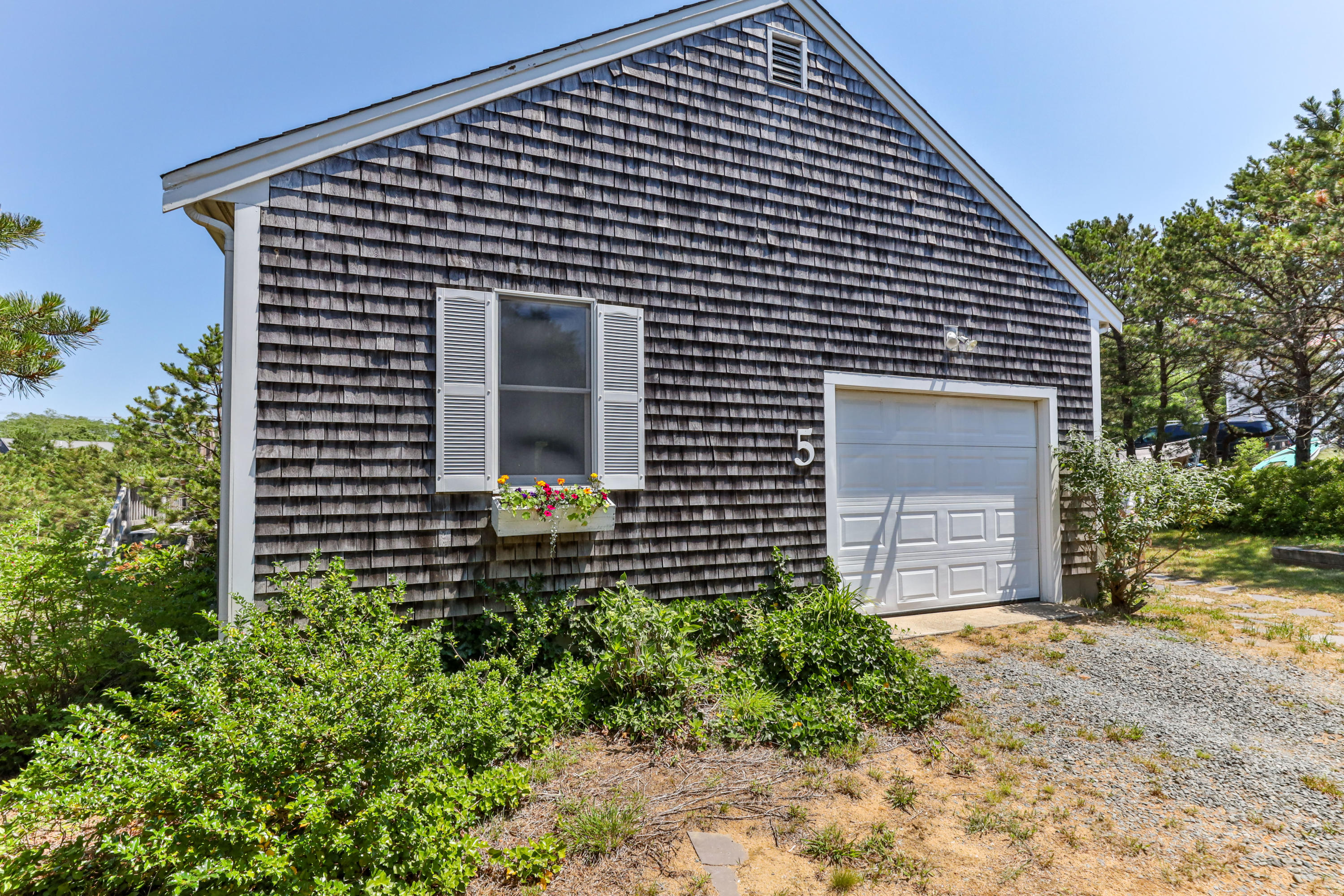 5 Starbuck Road Truro, MA 02666 - Photo 46 of 46 a front view of a house with garden