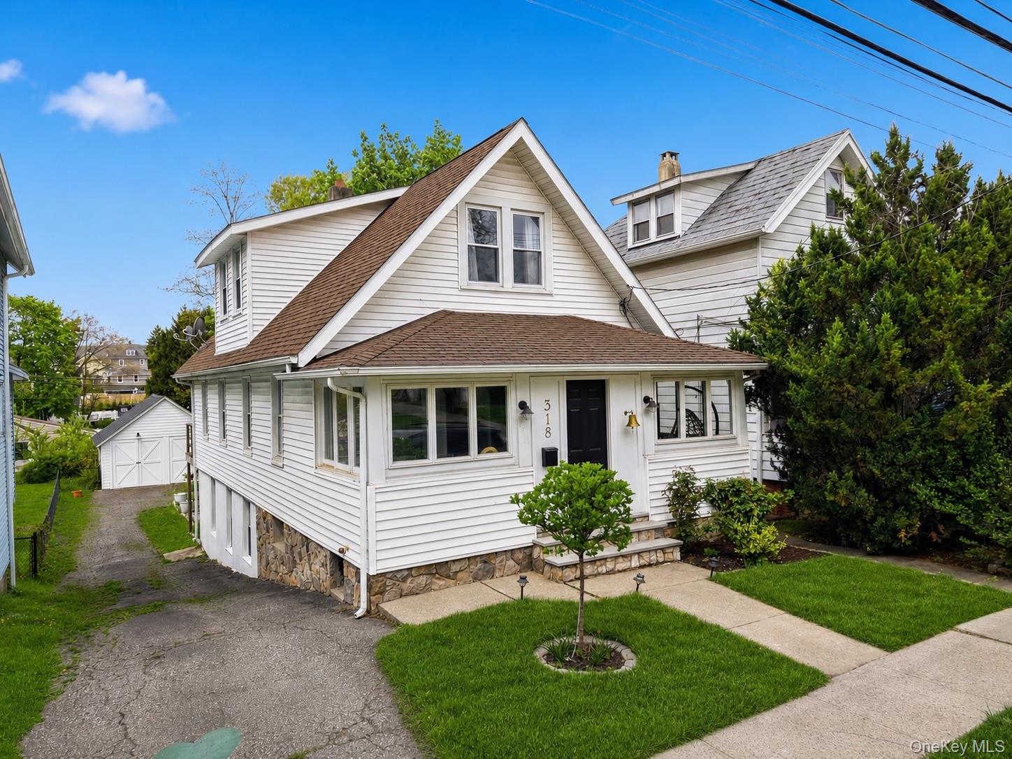 318 Union Avenue Peekskill, NY 10566 - Photo 1 of 30 a front view of a house with a yard porch and outdoor seating
