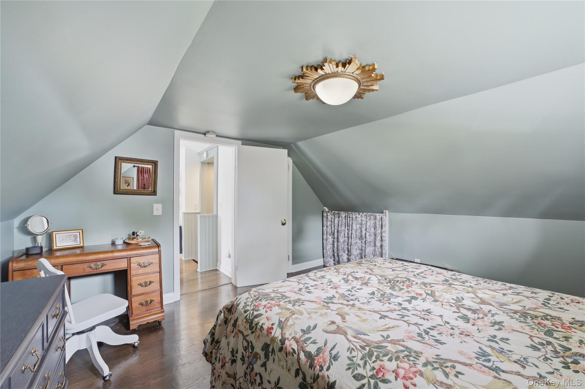318 Union Avenue Peekskill, NY 10566 - Photo 17 of 30 a bedroom with a bed and a chandelier