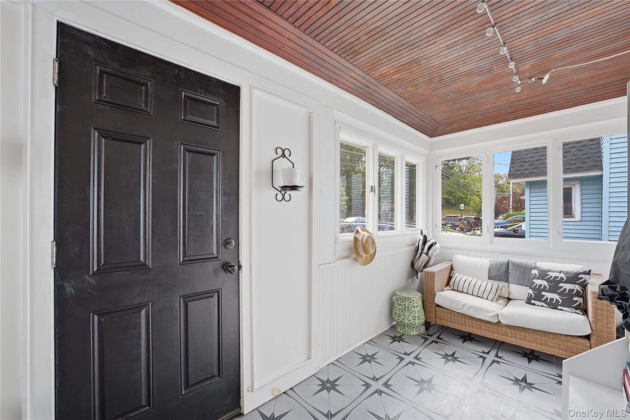 318 Union Avenue Peekskill, NY 10566 - Photo 22 of 30 a view of a balcony with furniture and floor to ceiling window
