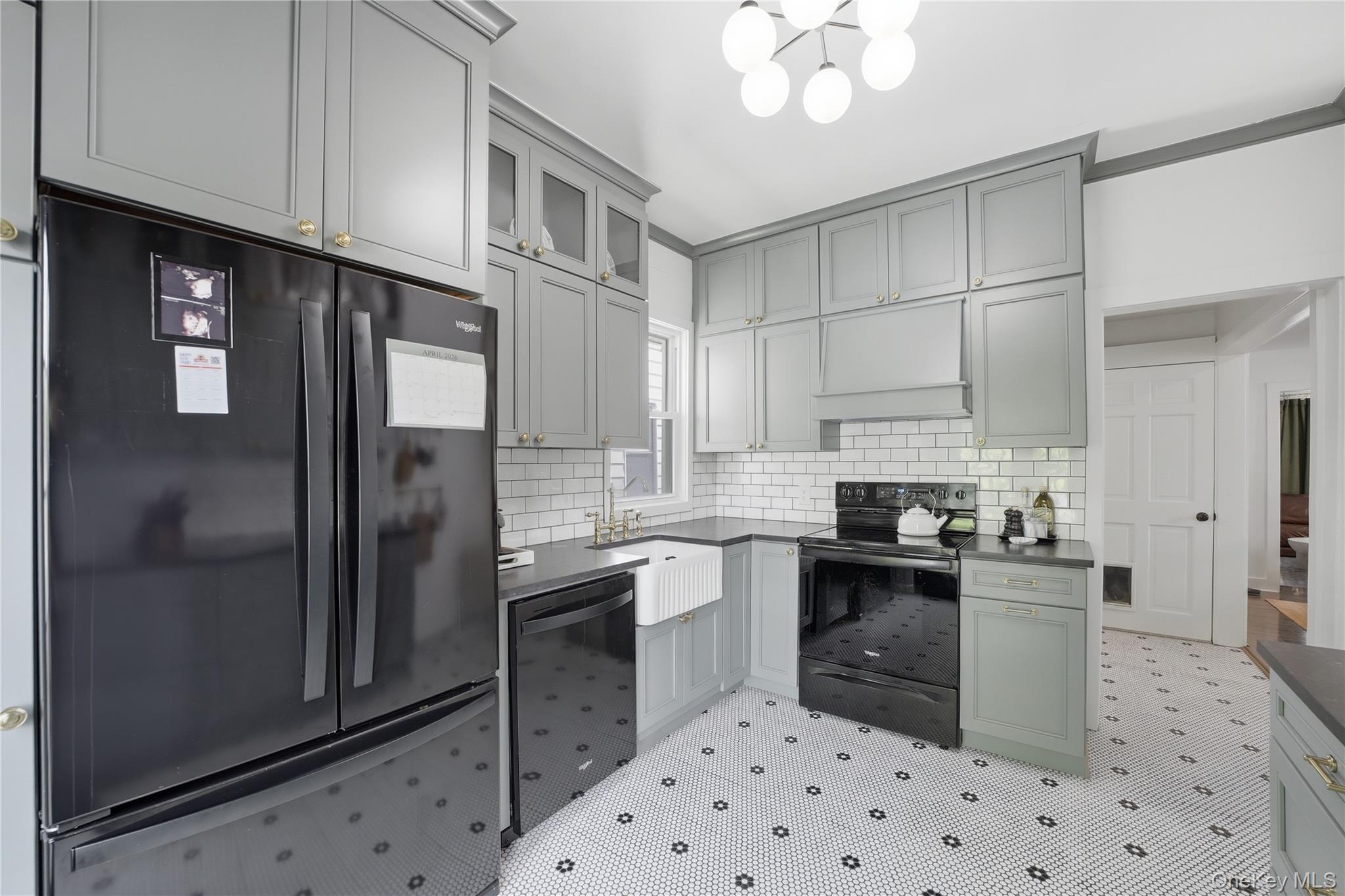 318 Union Avenue Peekskill, NY 10566 - Photo 4 of 30 a kitchen with granite countertop a sink stove and refrigerator