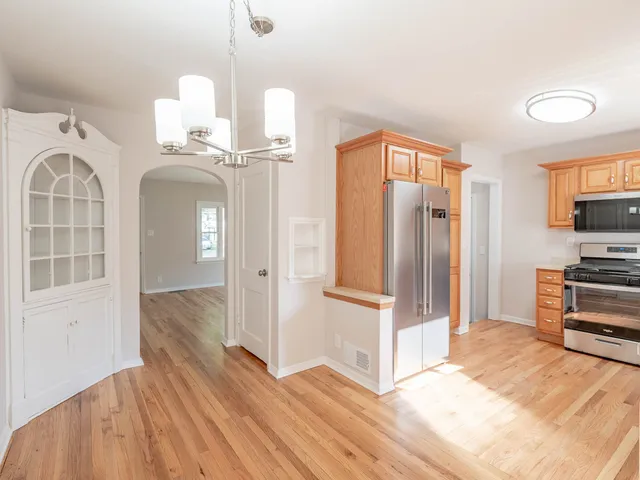 a view of a kitchen from the hallway