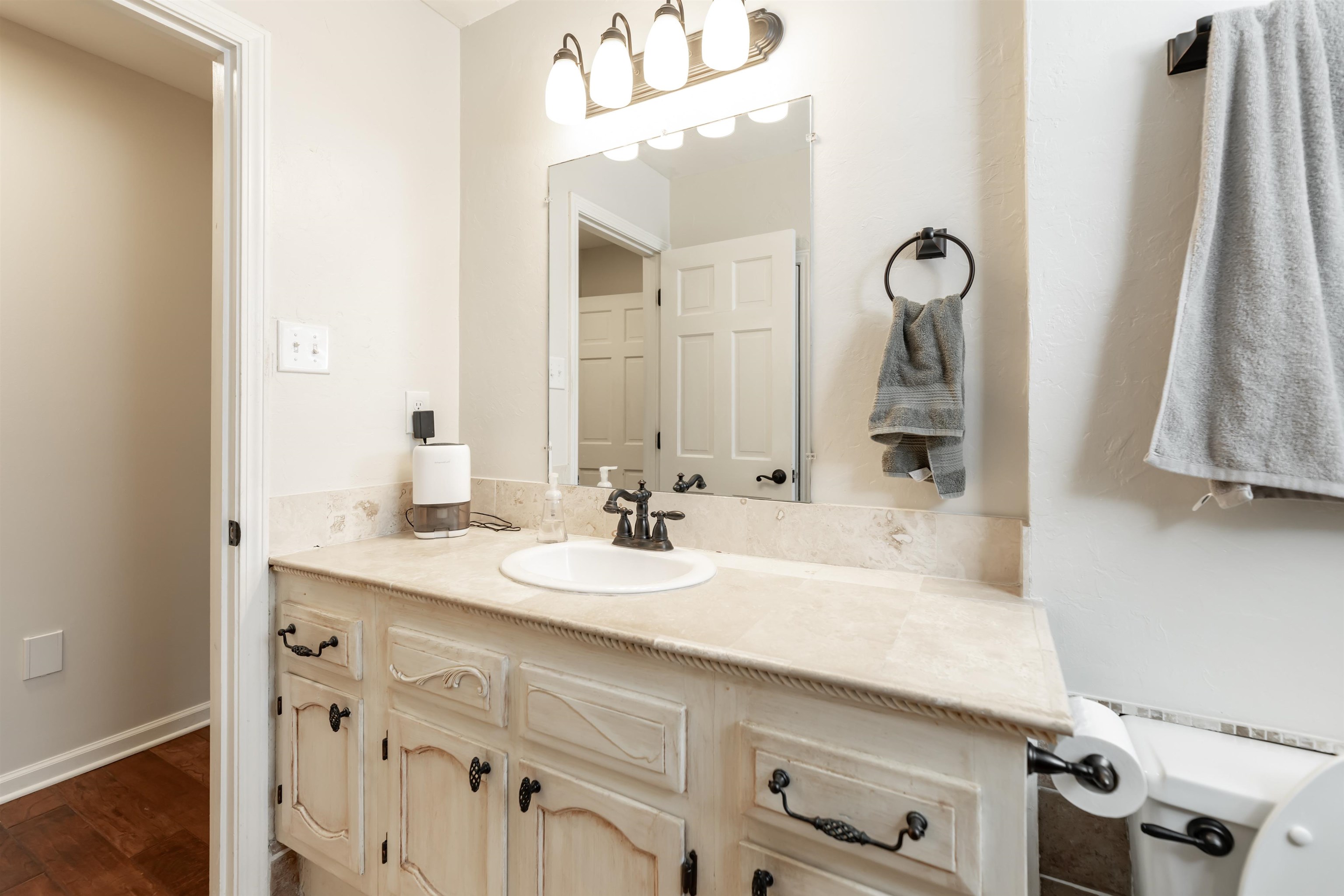 8441 Dogwood Road Germantown, TN 38139 - Photo 17 of 29 Bathroom featuring vanity and dark wood-type flooring