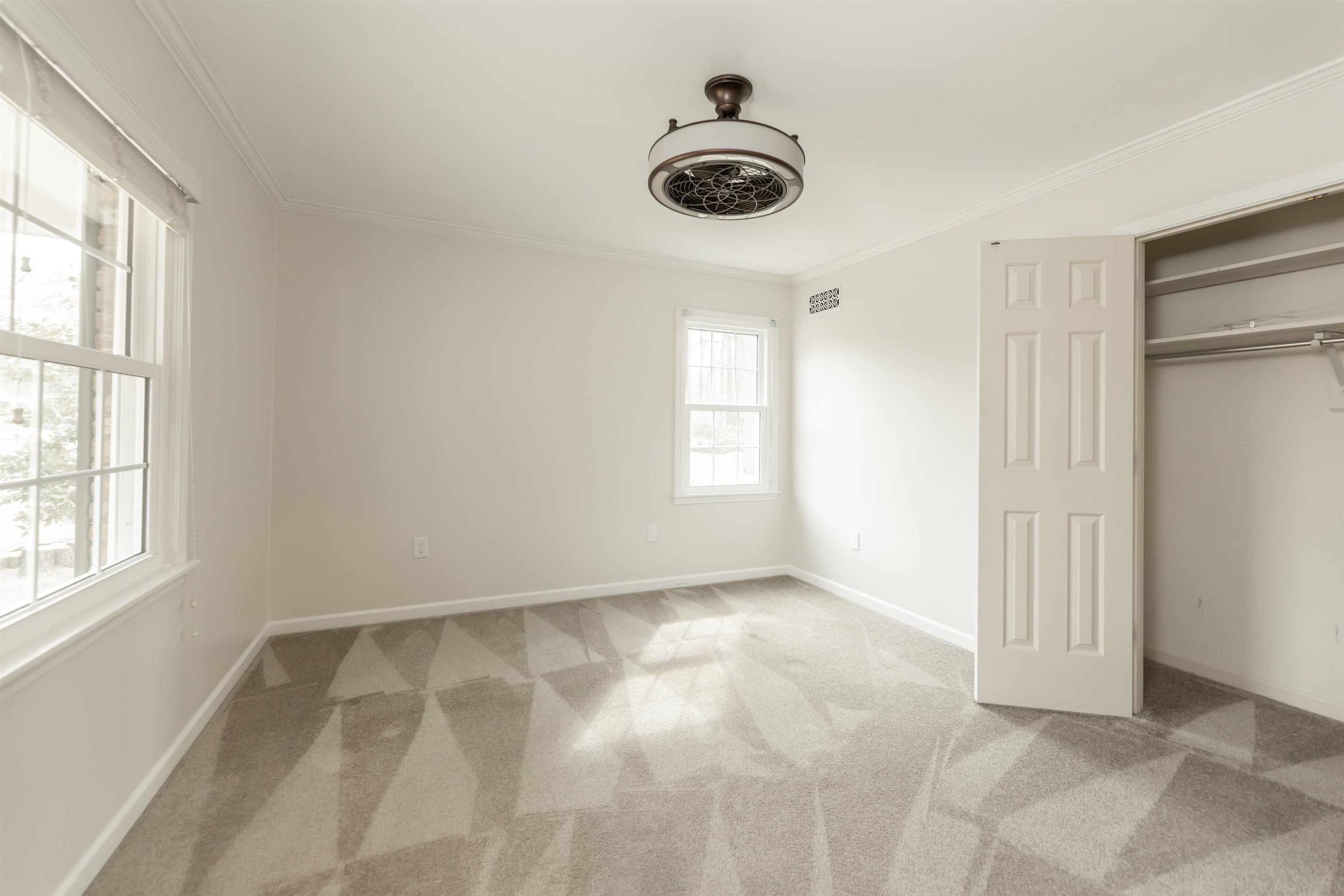 8441 Dogwood Road Germantown, TN 38139 - Photo 24 of 29 Unfurnished bedroom with ornamental molding, light carpet, and a closet