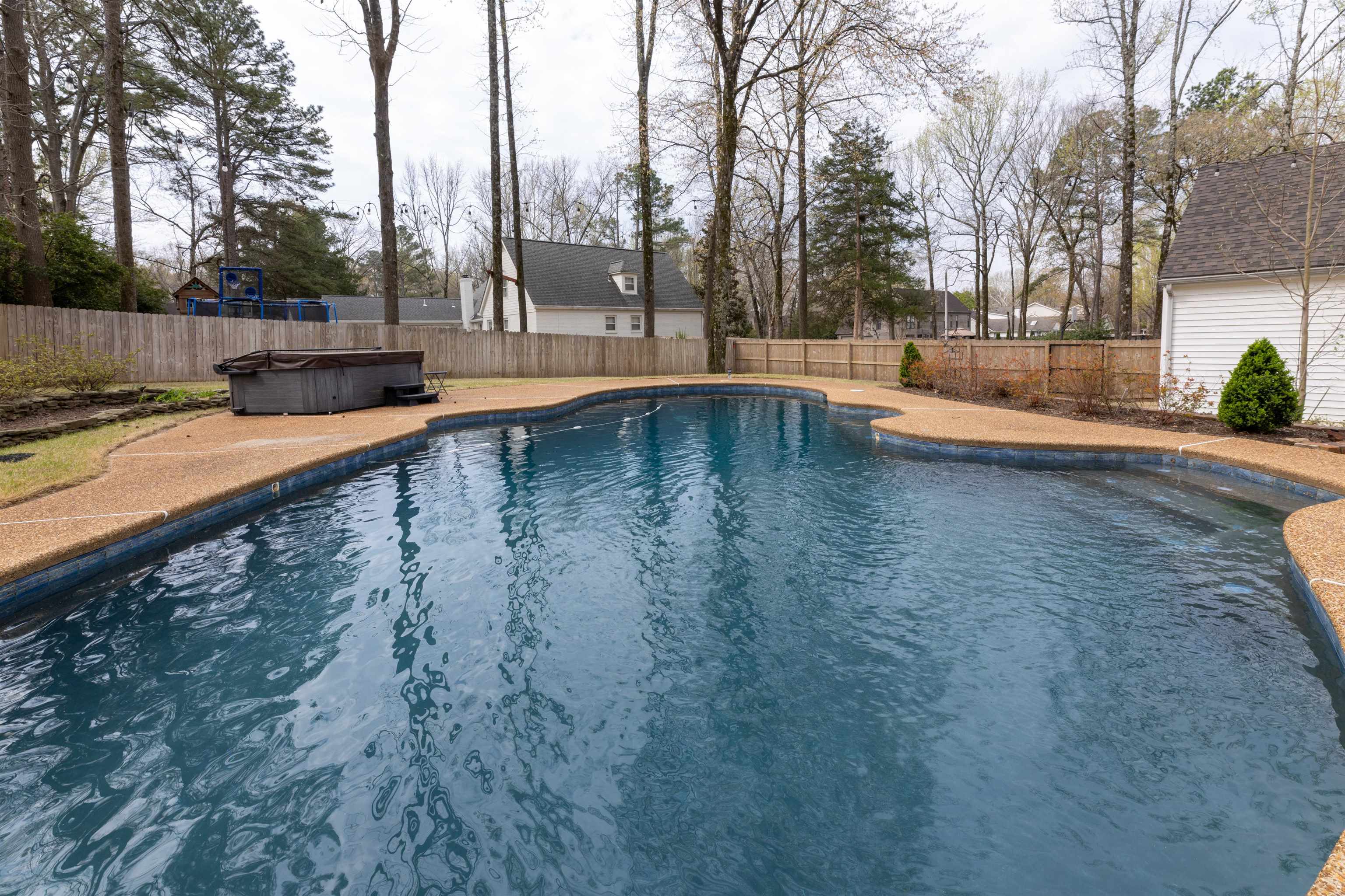 8441 Dogwood Road Germantown, TN 38139 - Photo 28 of 29 View of pool featuring a fenced backyard and a hot tub