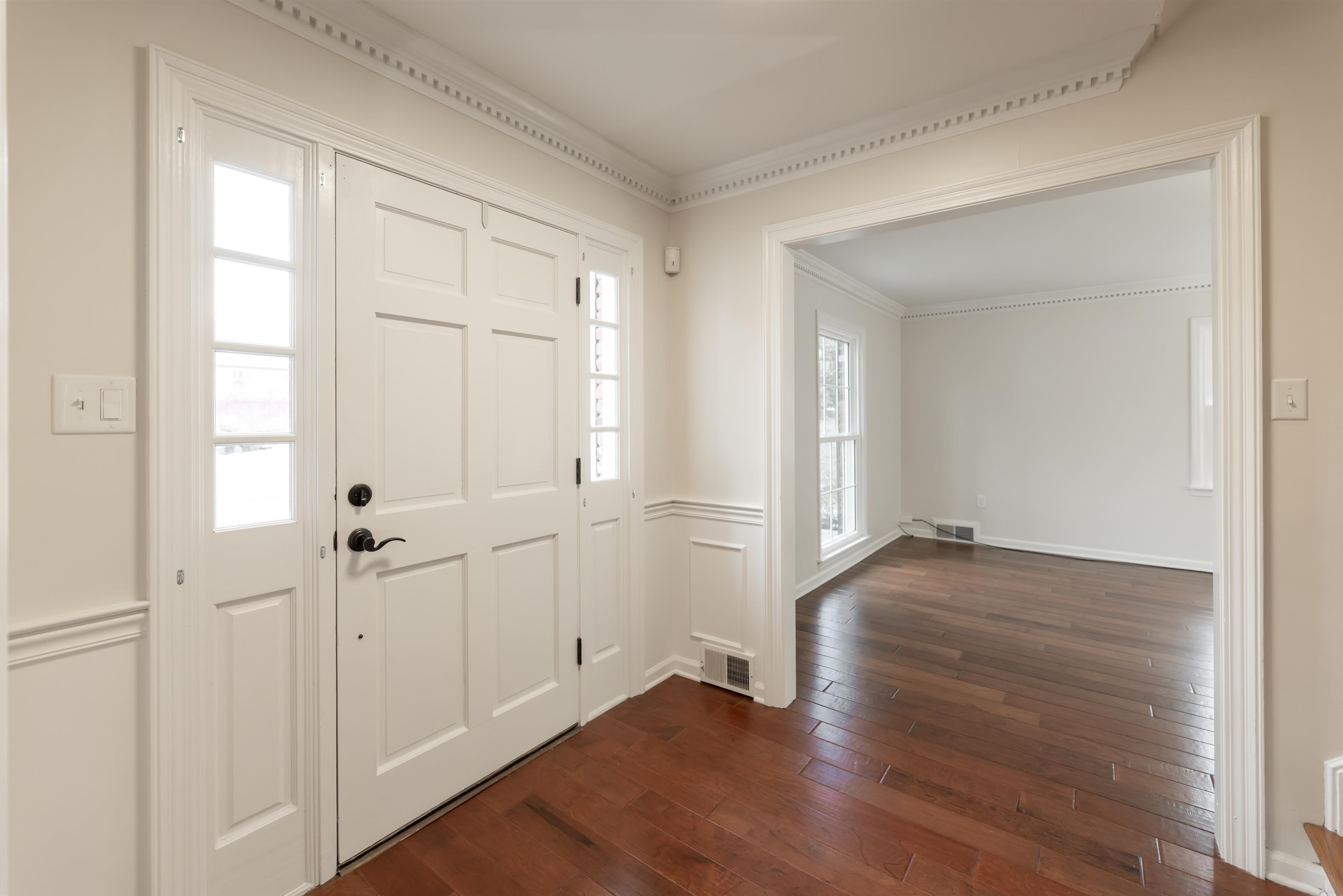 8441 Dogwood Road Germantown, TN 38139 - Photo 3 of 29 Entrance foyer featuring dark wood-style floors and ornamental molding