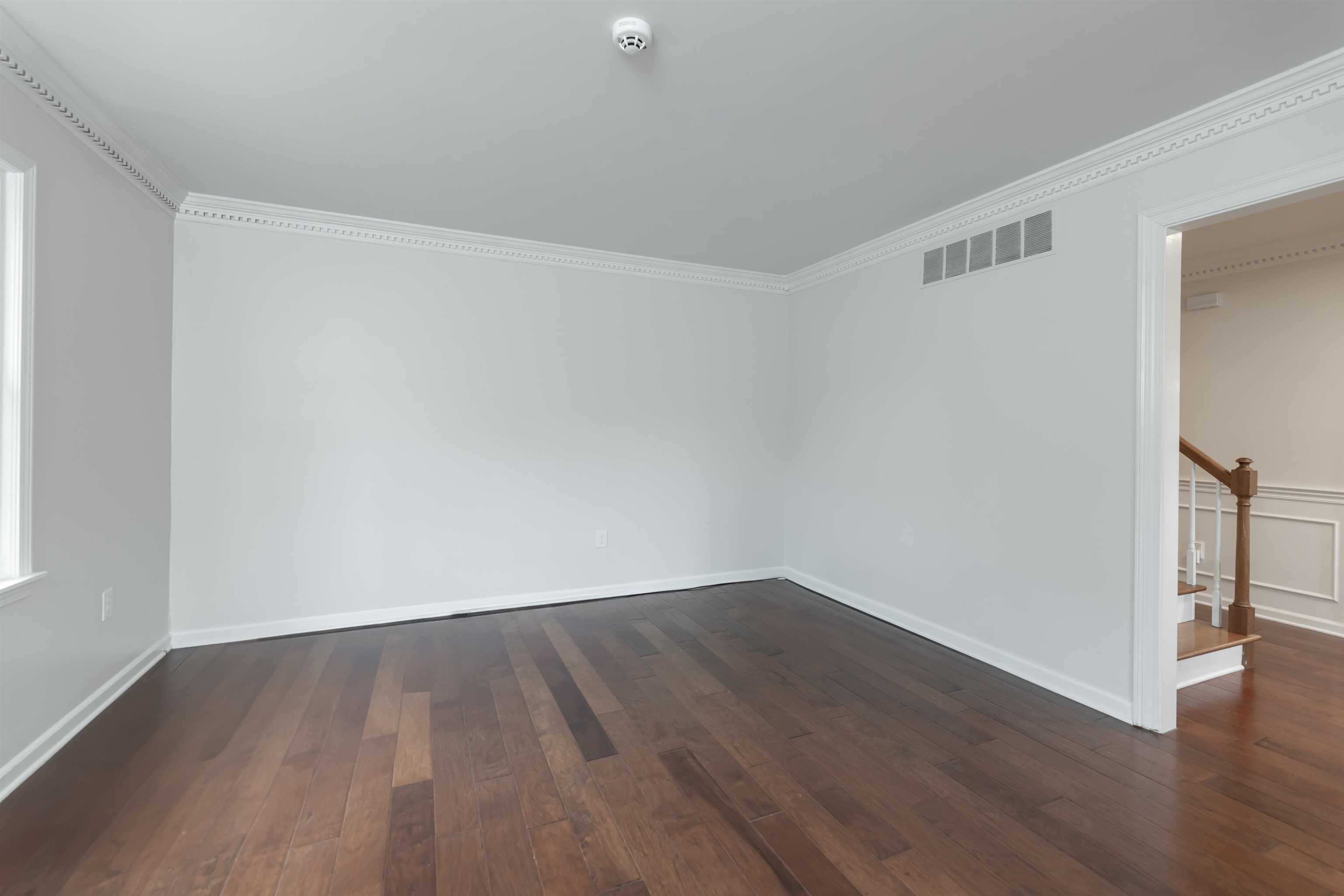 8441 Dogwood Road Germantown, TN 38139 - Photo 5 of 29 Spare room with ornamental molding and dark wood finished floors