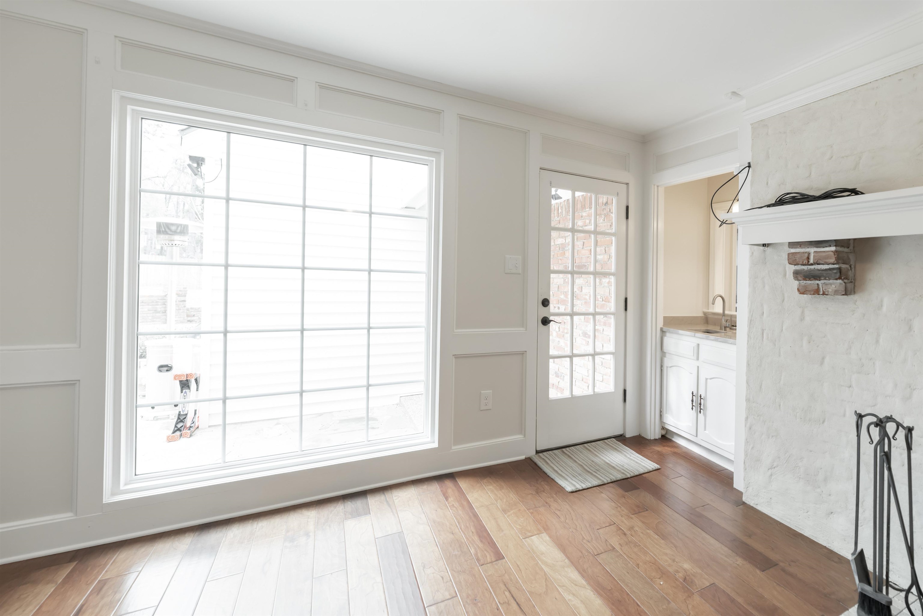 8441 Dogwood Road Germantown, TN 38139 - Photo 9 of 29 Doorway featuring wood finished floors, ornamental molding, and a decorative wall