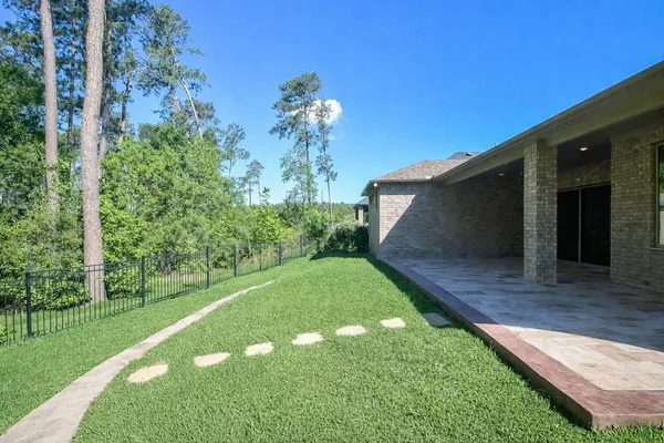 $625,000 | 604 Castlewood Cove Lane, Pinehurst, TX 77362