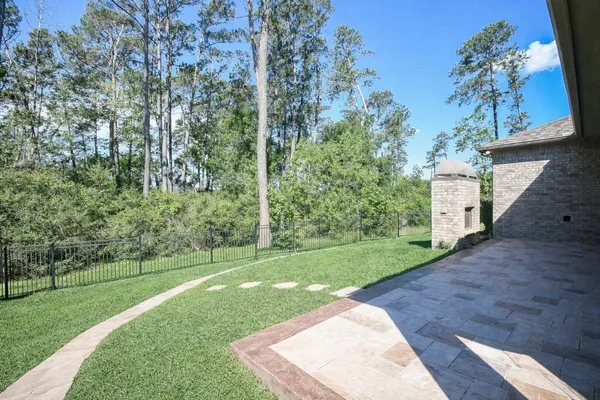 $625,000 | 604 Castlewood Cove Lane, Pinehurst, TX 77362