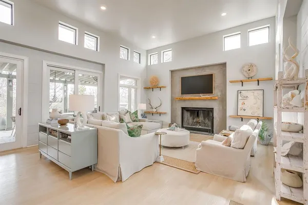 a living room with fireplace furniture and a flat screen tv